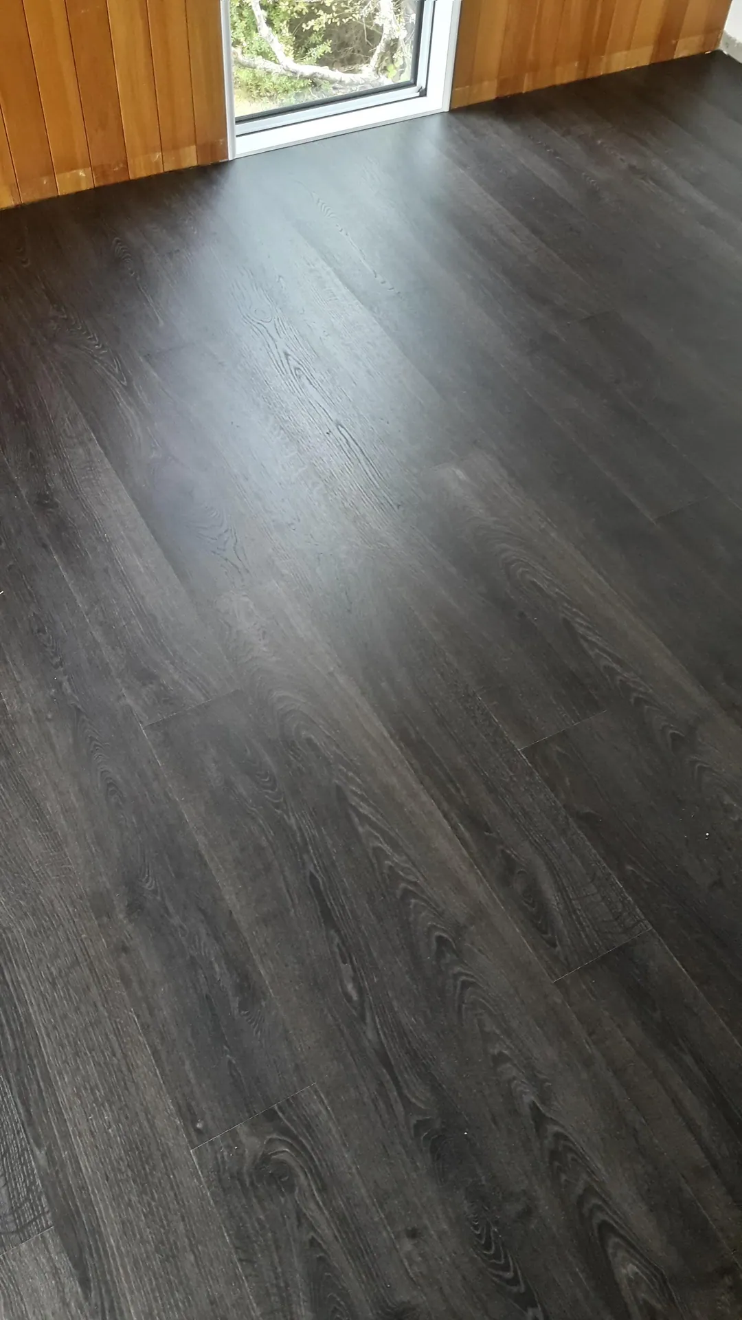 Dark grey timber-look boards up close.