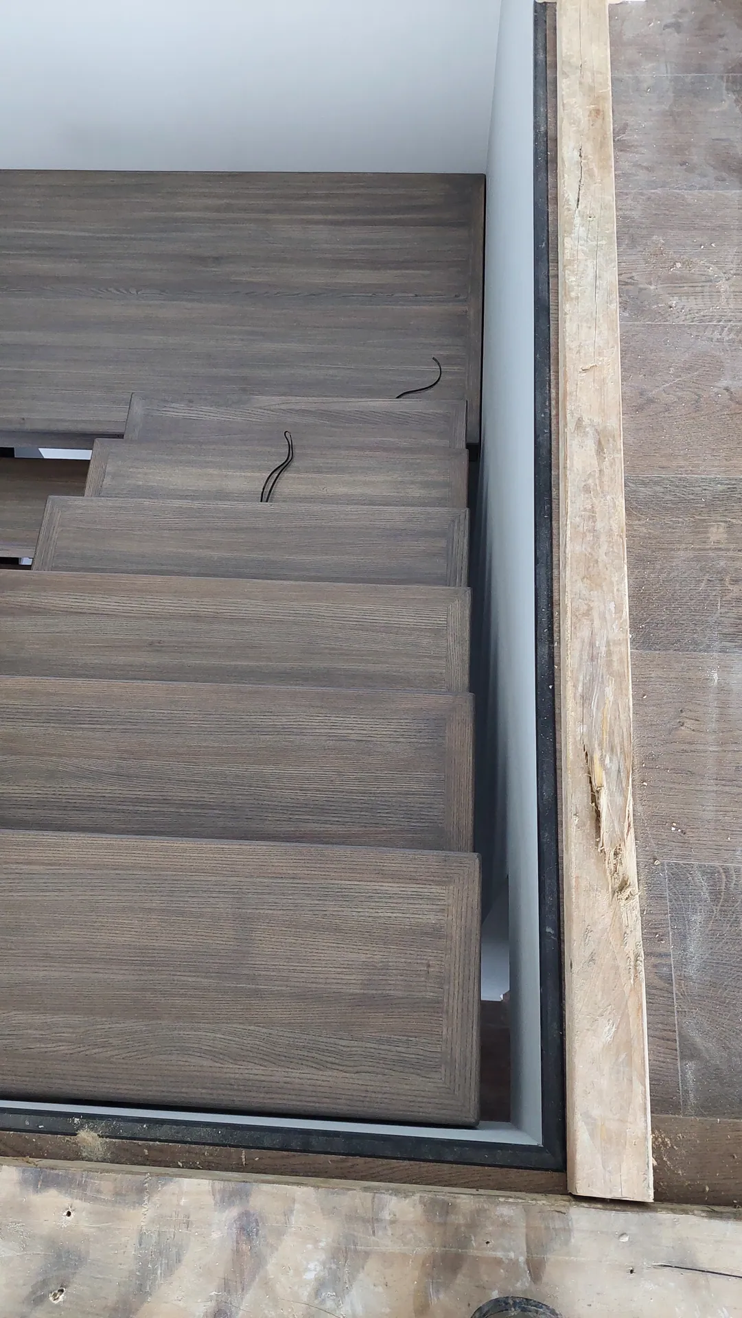 Grey oak stair treads from above.