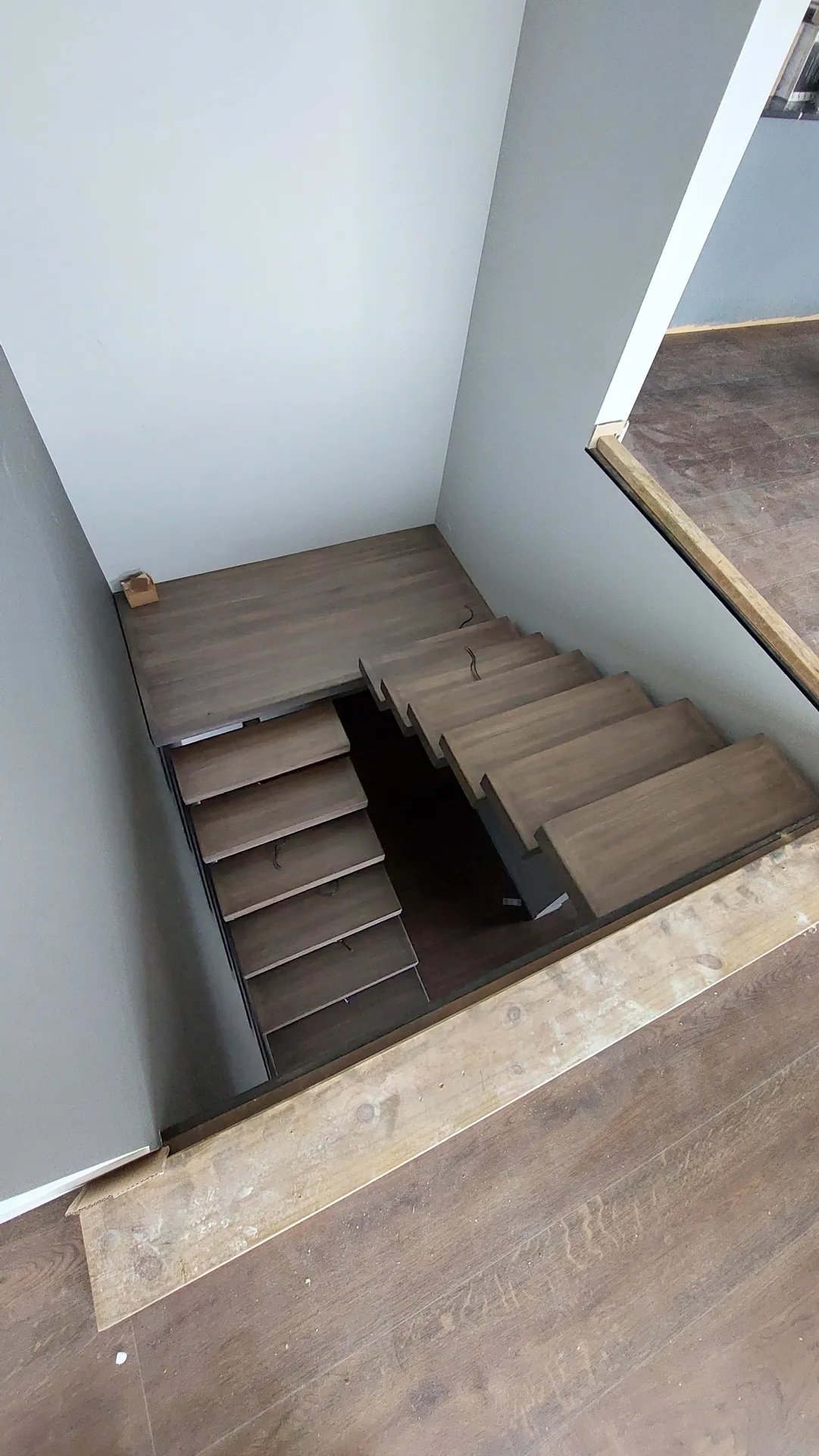 Grey oak winder stairs from above.