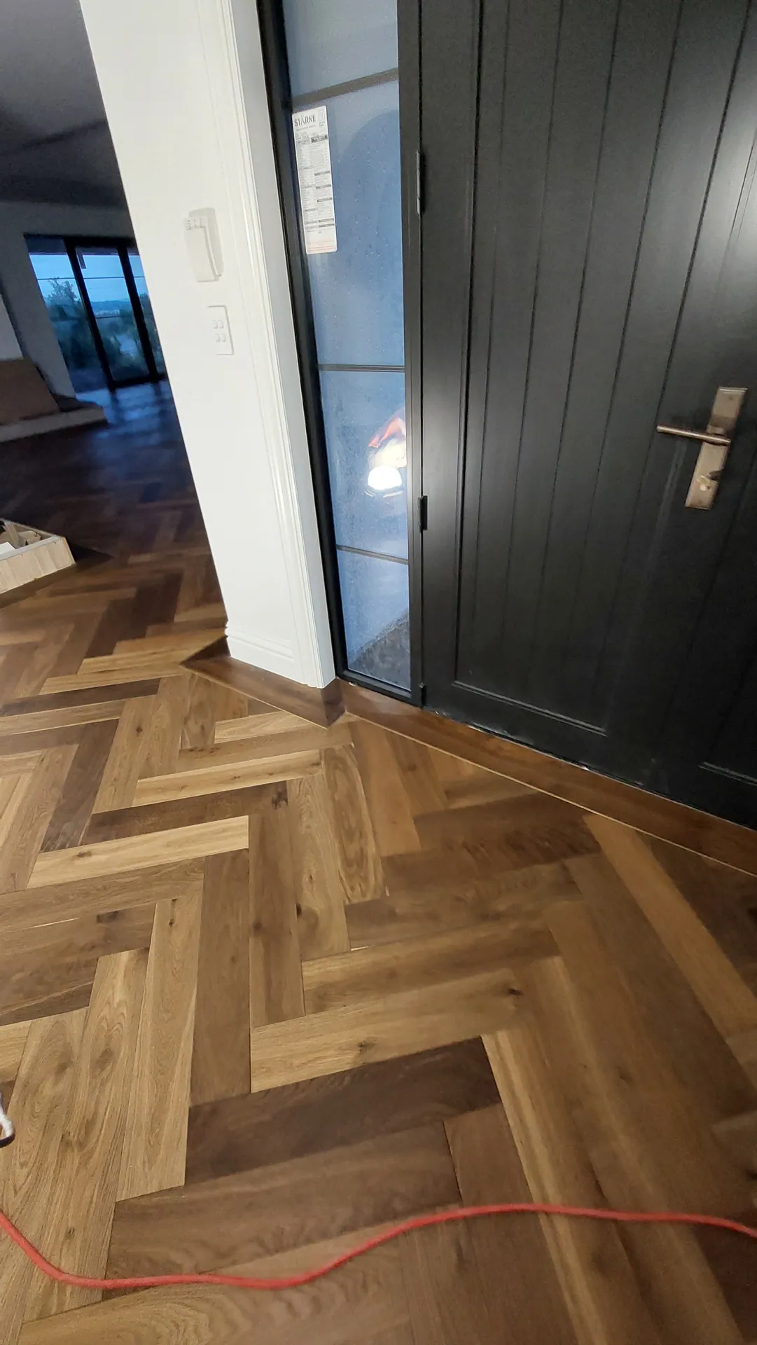 Herringbone oak at the front door.