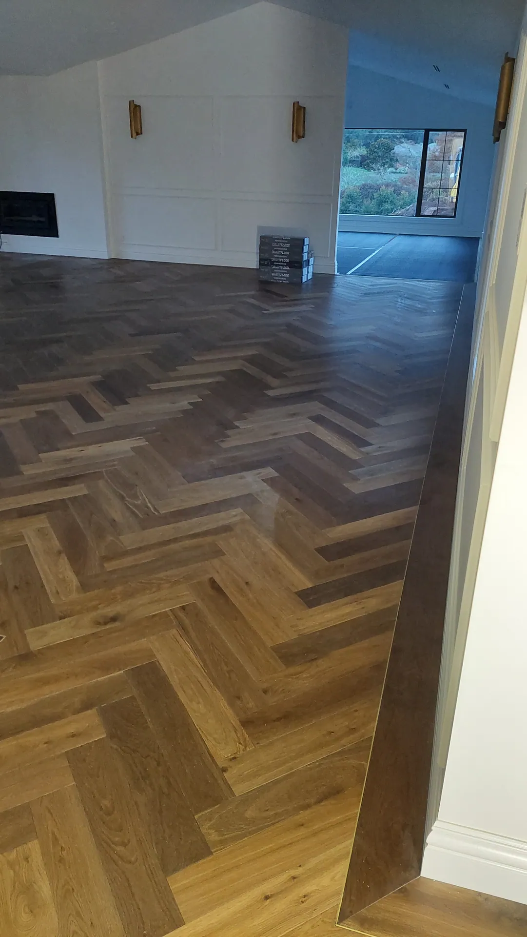 Herringbone oak through a living room.