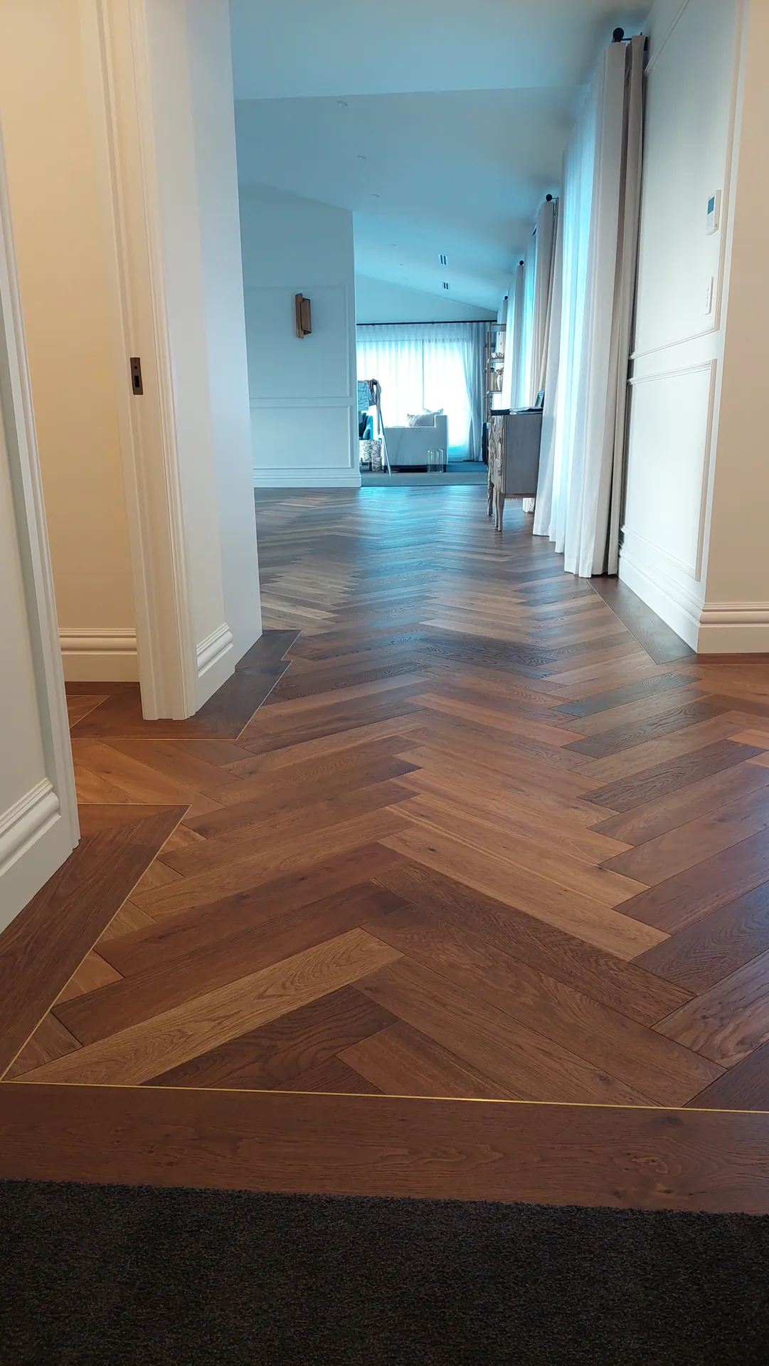 Herringbone with a border through a hallway.